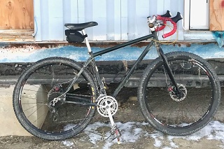 KHS Solo One SE, built in 2012 from a South Bay Los Angeles swap meet NOS frame and a QBP Karate Monkey fork that cost three times what the frame did. It needs a 94-58 bcd crank; the rings are too large. 